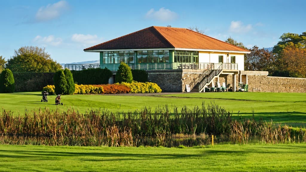 Clubhouse at East Clare Golf Club beside the course