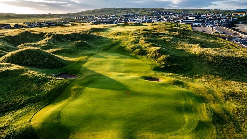 Lahinch links green with the town and Atlantic coast beyond